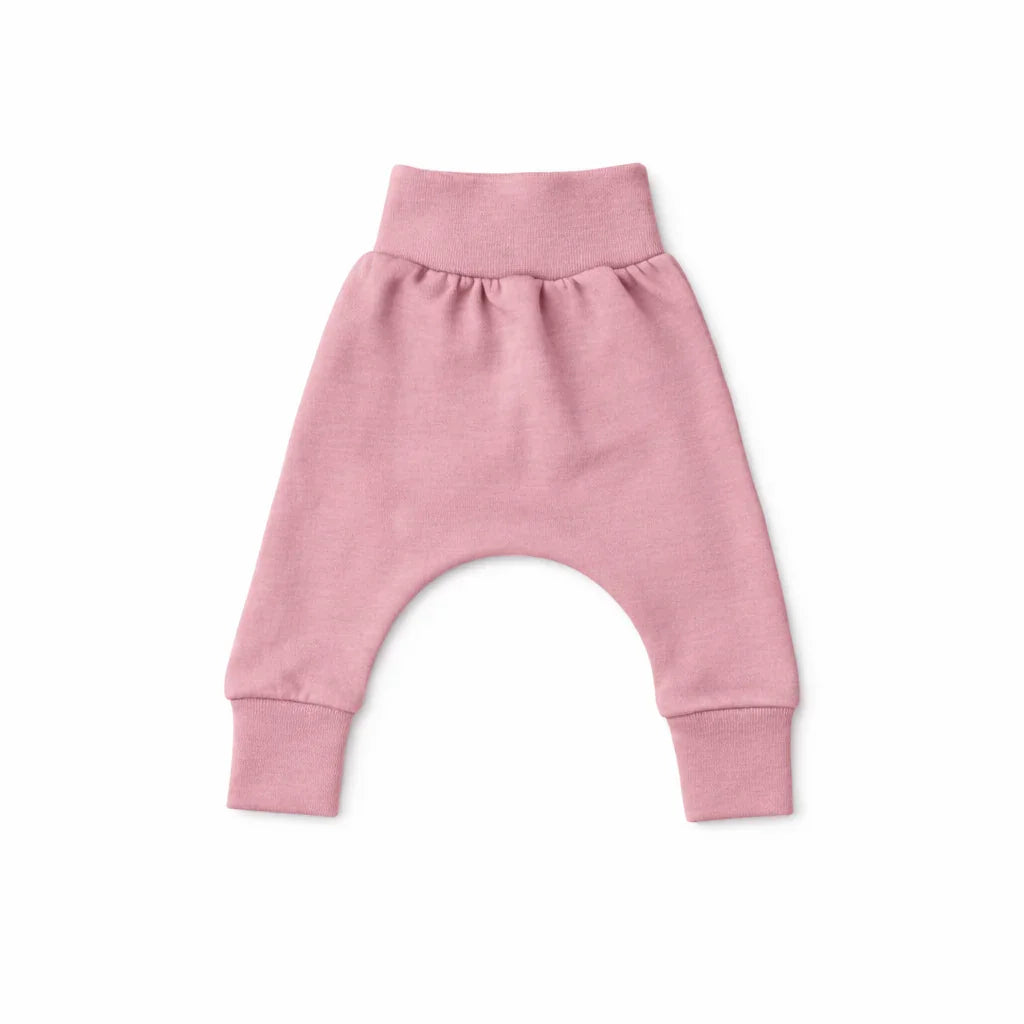 Soft pink baby harem pants with elastic waist and cuffs, cozy everyday essential for infants
