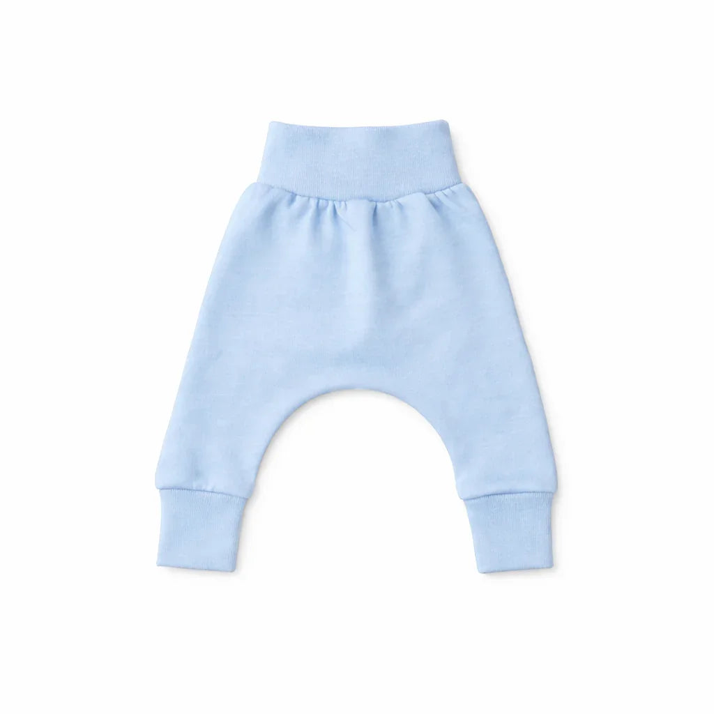 Soft light blue baby harem pants with elastic waist and cuffs, perfect for comfortable everyday wear.