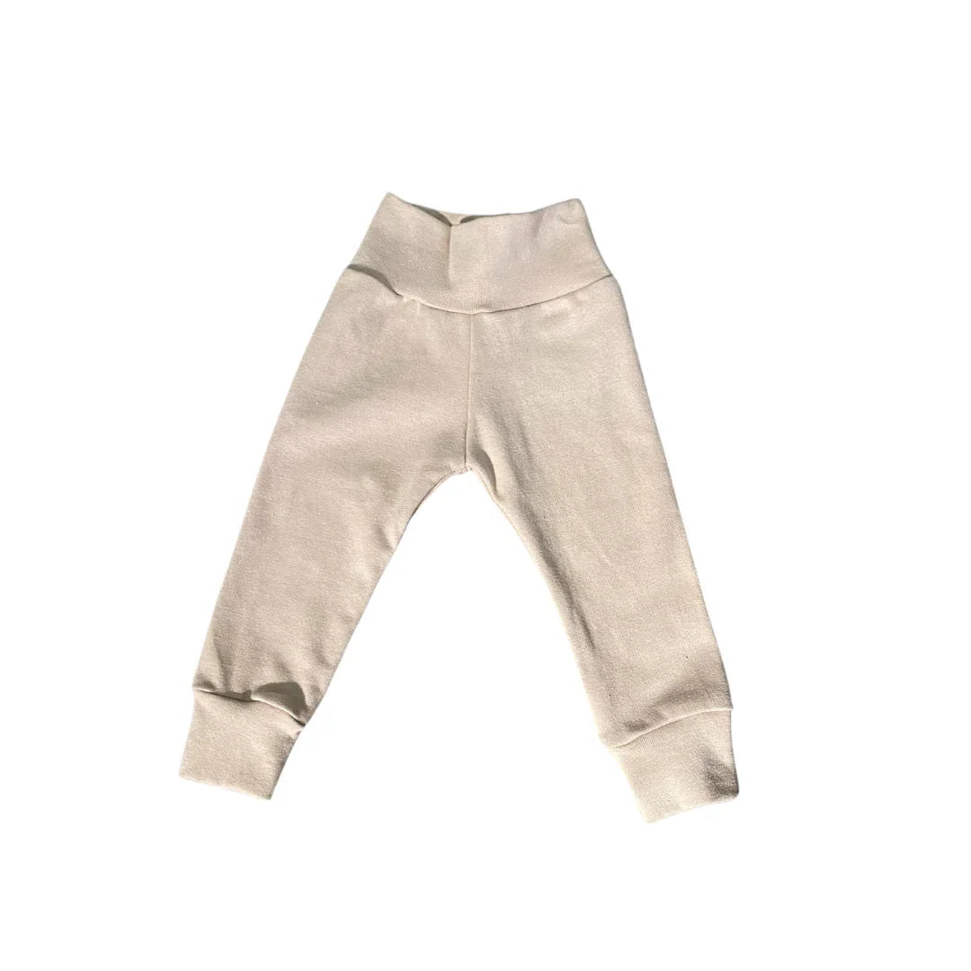 Soft beige baby joggers with elastic waist and cuffs, cozy everyday kids clothing