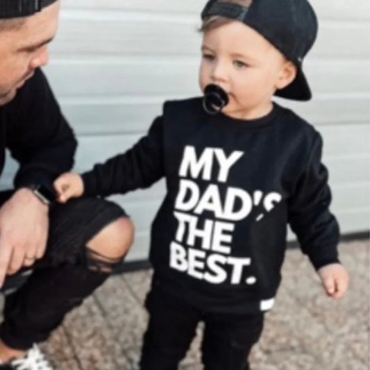 Toddler in black 'My Dad's The Best' sweatshirt with dad, matching outfits, baby clothing