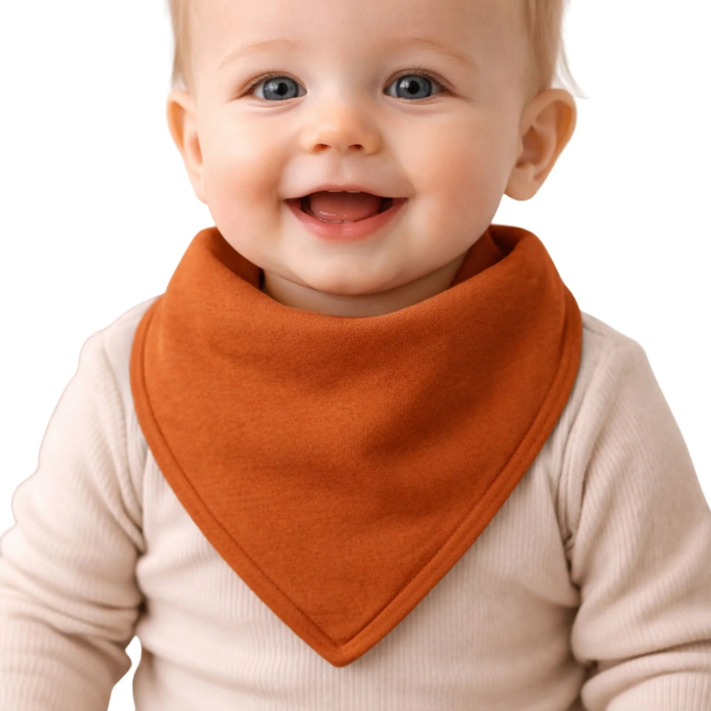 Smiling baby wearing rust orange bandana bib, soft cotton baby accessory for drool and meals