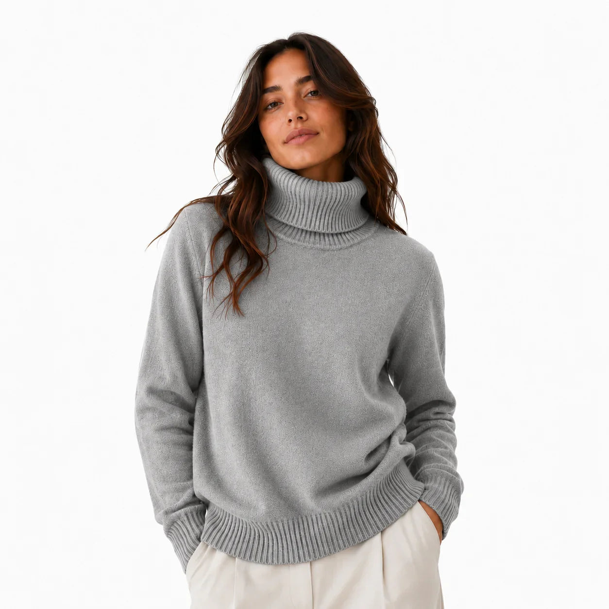 Gray turtleneck sweater with ribbed cuffs and hem, paired with cream pants