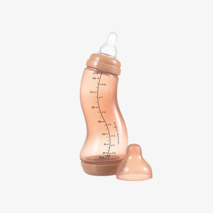 Pink baby bottle with measurement markings and detachable nipple, ideal for infant feeding