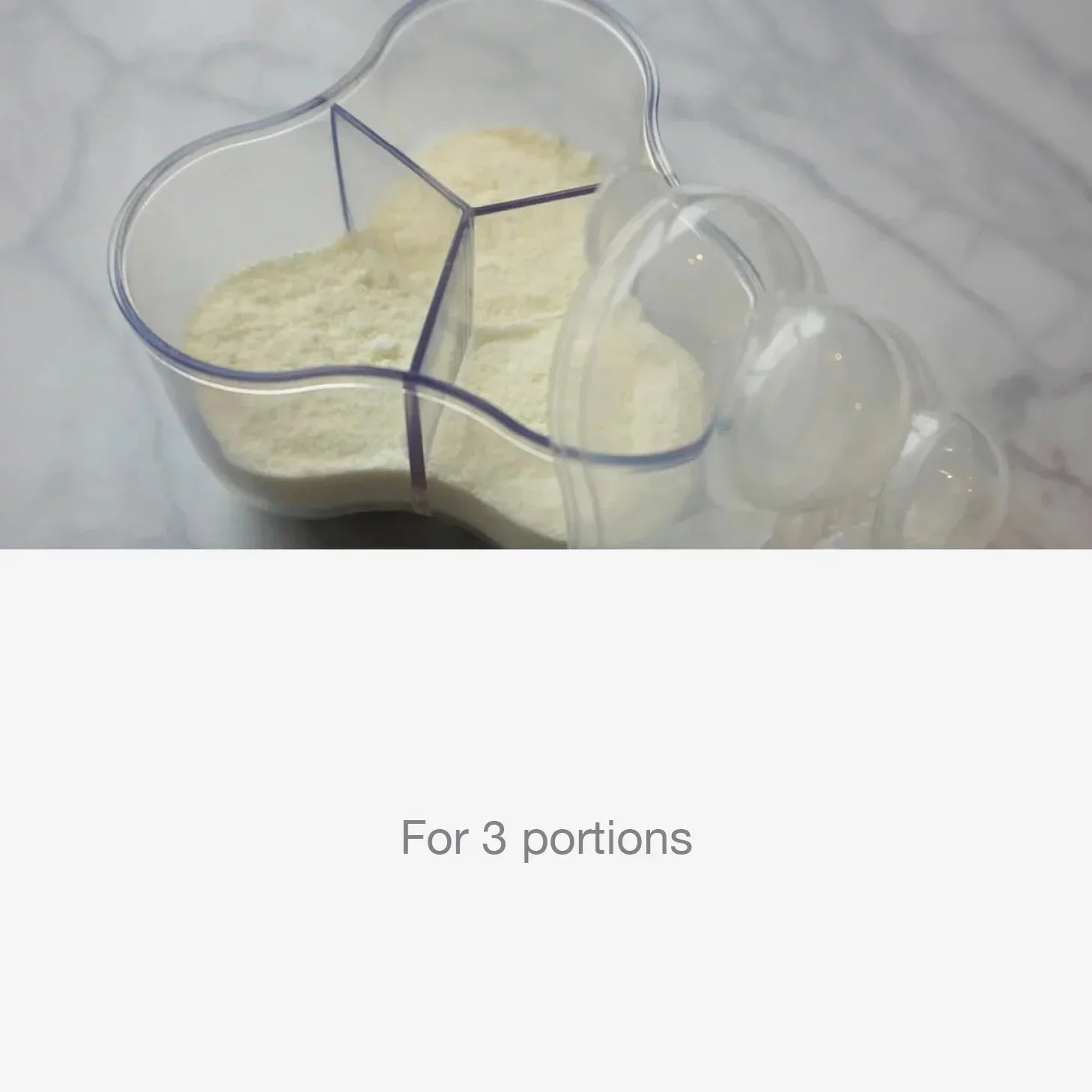 Clear 3-section baby formula dispenser with measured portions on marble surface